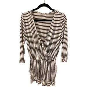 About a Girl romper. Size L. Black and white stripe. 1 closure at chest.